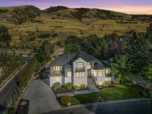 Aerial view at dusk featuring a mountain view