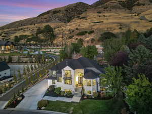 Aerial view at dusk featuring a mountain view