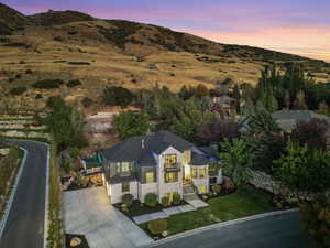 Aerial view at dusk featuring a mountain view