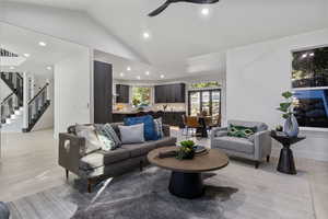 Living room with light wood-type flooring and lofted ceiling