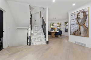 Stairway with hardwood / wood-style floors