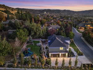 Aerial view at dusk featuring a mountain view