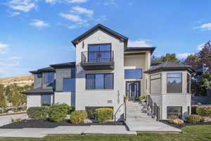 View of front of house featuring a balcony