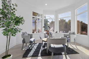 Sunroom / solarium featuring a healthy amount of sunlight