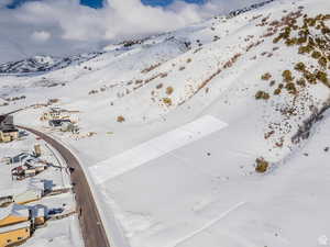 Snowy aerial view with a mountain view