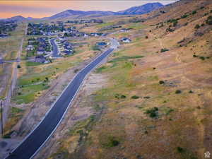 Aerial view at dusk featuring a mountain view