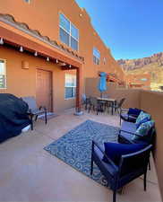 View of patio featuring a mountain view and an outdoor hangout area