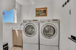 Laundry room with sink and privacy door.