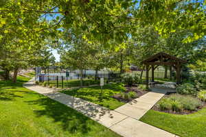 View of the open space with a gazebo, basketball court, dog park, walking trail and picnic pavilion