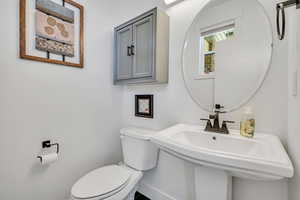 Main floor guest bathroom right off of kitchen.