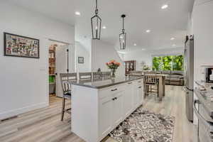 Open concept, large walk-in pantry and 4 seat expanded island with pull out trash cabinet.