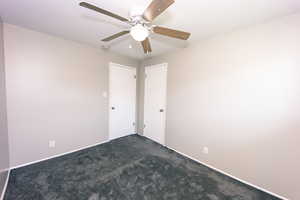 #3 Bedroom view 1 Gray Carpeted room featuring ceiling fan - closet and door to hall