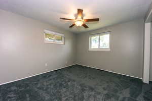 Bedroom #1 view two ceiling fan and a wealth of natural light