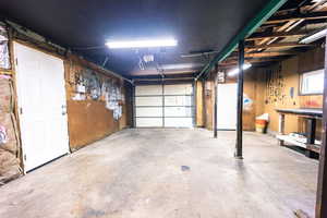 View of garage with garage door opener.