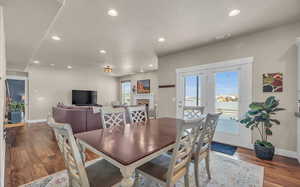 Dining area with hardwood / wood-style flooring and plenty of natural light