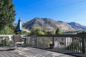 Wooden terrace featuring a mountain view