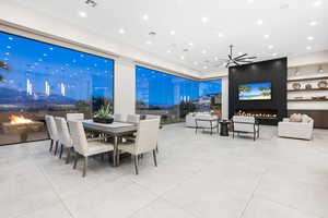 Tiled dining area with a fireplace