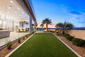 Yard at dusk with a patio area