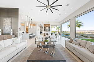 Tiled living room with a water view and sink