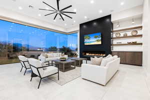 Tiled living room featuring a large fireplace