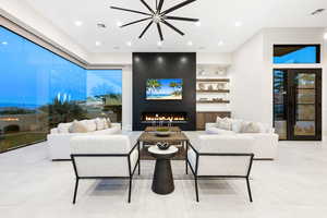 Living room featuring a fireplace and light tile patterned floors