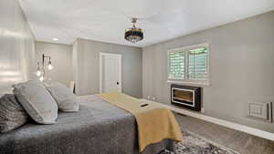 Bedroom featuring a textured ceiling and carpet