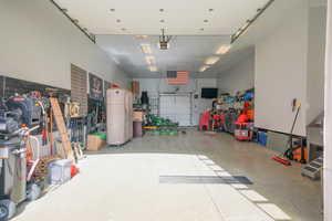 1800 Sq feet Garage featuring a garage door on boths ends