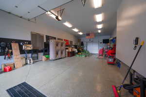 1800 sq feet of Ex-long Garage featuring a garage door on both the south and north sides