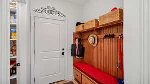 Mudroom featuring wood-type flooring