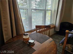 Dining room featuring dark hardwood / wood-style flooring and plenty of natural light