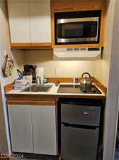 Kitchen with appliances with stainless steel finishes and sink