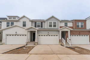 View of front of home featuring a garage