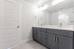 Bathroom with vanity and a textured ceiling