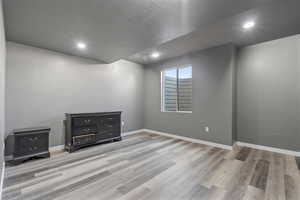 Bedroom #6 featuring a textured ceiling