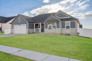 Craftsman house featuring a front yard, a porch, and a garage. Photoshopped with grass