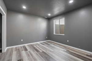 Bedroom #5 with a textured ceiling