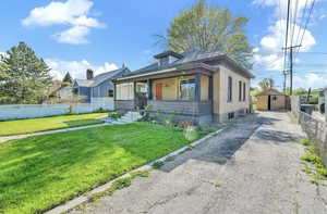 Bungalow-style house with a front yard