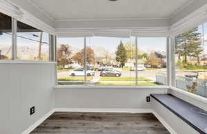 Unfurnished sunroom with a mountain view