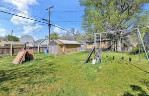 View of yard with a storage unit