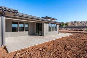 Rear view of property featuring a patio and a mountain view