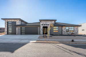 Prairie-style home with a garage