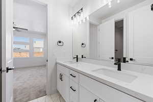 Bathroom featuring ceiling fan and vanity