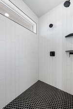 Bathroom with tiled shower