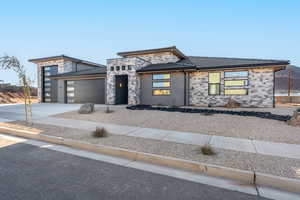 Prairie-style house featuring a garage