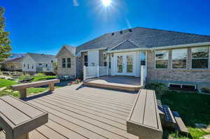 Back of property with a wooden deck