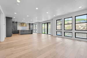 Unfurnished living room with light hardwood / wood-style floors