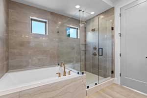 Bathroom with plus walk in shower and tile patterned floors