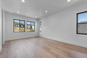 Spare room with light wood-type flooring