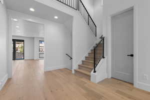 Stairs with hardwood / wood-style floors