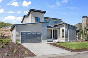 Contemporary house featuring a front lawn